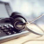 Headset headphones and telephone in call center