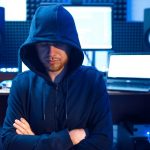 Hacker in hood, network criminal, internet spy