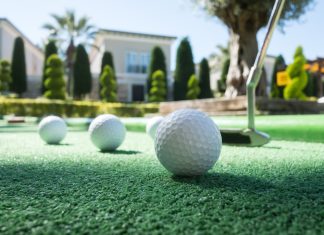 7 Interesting Facts About Mini Golf Mini golf scene with ball and club