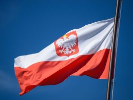 Top 10 Interesting Facts About Poland the-state-flag-of-poland-with-the-emblem-of-the-re