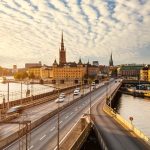 Scenic view of old buildings and car traffic at the bridge Stockholm, Sweden.