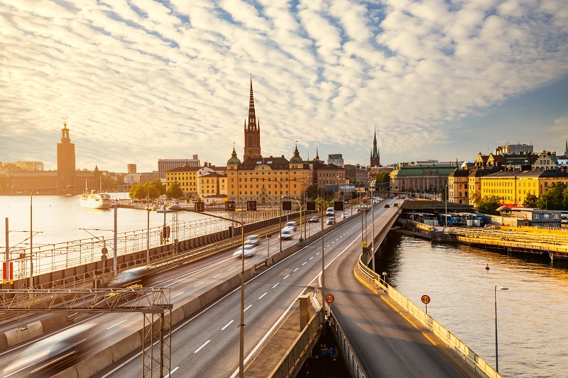 Scenic view of old buildings and car traffic at the bridge Stockholm, Sweden.