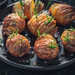 Tasty Hasselback with herbs and oil. Swedish cuisine.